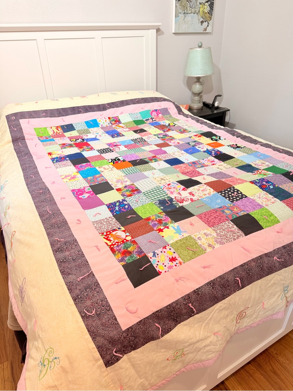 Hand crafted patchwork quilt with tan border